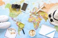 Traveler`s accessories and items with copy space on world map background, travel by airplane concept. Royalty Free Stock Photo