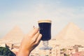 Traveler\'s breakfast. A table in an outdoor restaurant with a fantastically beautiful view of the great pyramids of Giza. Cairo.