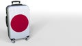 Traveler`s suitcase featuring flag of Japan. Japanese tourism conceptual 3D rendering, blank space for caption