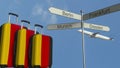 Travel baggage featuring flag of Germany, airplane and city sign post. German tourism conceptual 3D rendering Royalty Free Stock Photo