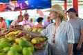 Traveler shopping on traditional Victoria food market, Seychelles.