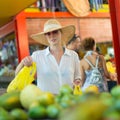 Traveler shopping on traditional Victoria food market, Seychelles.