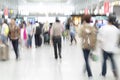 Traveler silhouettes in motion blur, airport interior Royalty Free Stock Photo