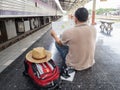 Traveler sitting and looking at the map in train station. Travel concept Royalty Free Stock Photo