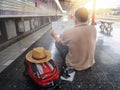 Traveler sitting and looking at the map in train station. Travel concept Royalty Free Stock Photo