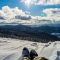 Traveler sitting on mountain peak. Panoramic view from mountain Zakhar Berkut, Carpathian mountains, Ukraine