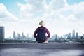 A traveler sitting on the rooftop