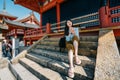 Traveler sitting on stairs after visited temple