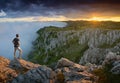 Traveler standing on a cliffs edge