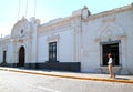 Traveler standing in front of White Sillar Stone Vintage Buildings of the Old City of Arequipa, Peru