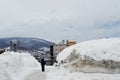 The traveler is standing in thick snows and looking to Otaru city in Hokkaido Japan 2018