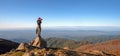 Traveler standing on top of the cliff and taking photos Royalty Free Stock Photo