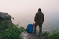 Traveler successful young man standing on top of Mountain and wa Royalty Free Stock Photo