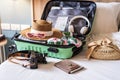 Traveler suitcase and luggage with travel accessories and items preparing