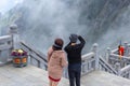 Traveler take photo view of mountain with mobile phone