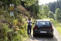 Traveler thai woman driving car stop on lateritic soil road