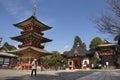 Traveler thai women looking map and reading guide book about Daitou Pagoda of Naritasan Shinshoji Temple at Chiba in Tokyo, Japan