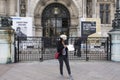 Traveler thai women looking map and reading guide book at front of Hotel de Ville