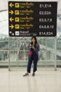 Traveler thai women posing for take photo with general and information board