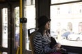 Traveler thai women sitting in retro tramway go to travel around Prague city
