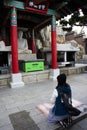 Traveler thai women travel visit and respect praying blessing wish holy mystery ancient stone buddha in Haedong Yonggungsa temple