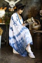 Traveler thai young women wear indigo tie dye paint shawl and scarf posing portrait sit read magazine book for take photo with