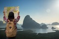 Traveler tourist asia women with map travel see the mountain view in the sunrise. Royalty Free Stock Photo