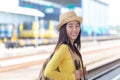 Traveler and tourist asian women wearing backpack near station the train. Travel and Trips