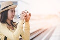 Traveler and tourist asian young women wearing backpack holding camera take a photo