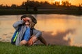 Traveler tourist kid. Young boy looking through binoculars. Little explorer. Outdoor recreation and adventures with kids Royalty Free Stock Photo