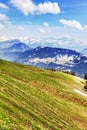 Traveler trekking on Rigi kulm with landscape view of Alps snow Royalty Free Stock Photo