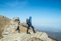 Traveler with backpack on the top of the mountain Royalty Free Stock Photo