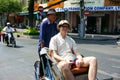 Traveler visit view of Sai gon by pedicab. SAI GON, VIET NAM- MARCH 4