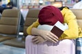 Traveler waiting and sleeping at the area lounge airport terminal, Passenger tired for delayed boarding flight. Royalty Free Stock Photo