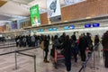 A traveler waiting to check-in before departure at New Chitose Airport, Hokkaido, Japan