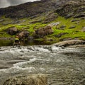 Traveler walk against beautiful Scotland nature photo.