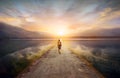 Traveler walking along the road to the mountains Royalty Free Stock Photo