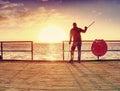 traveler walking balance with forearm crutch on wooden bridge