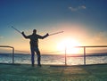 traveler walking balance with forearm crutch on wooden bridge