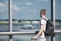 Traveler watching airplanes at airport