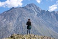 A traveler watching on mountain landscape, Kazbeg mountain - Kazbegi (Stepantsminda), Georgia