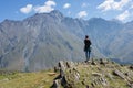 A traveler watching on mountain landscape, Kazbeg mountain - Kazbegi (Stepantsminda), Georgia
