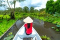 Traveler woman on a boat tour along the canals in the mangrove forest