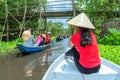 Traveler woman on a boat tour along the canals in the mangrove forest.