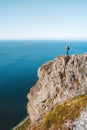 Traveler woman on cliff hiking mountains in Norway Travel Lifestyle adventure active vacations outdoor Royalty Free Stock Photo
