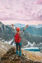 Traveler woman climbing mountain in Norway hiking travel outdoor adventure healthy lifestyle