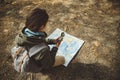 Traveler woman with a compass and map outdoor