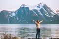 Traveler woman hands raised enjoying Norway mountains view Royalty Free Stock Photo