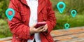 Traveler woman hands use map on mobile phone app to search for route location of place with gps on a street when travel