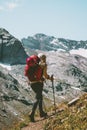 Traveler woman hiking alone at rocky mountains Royalty Free Stock Photo